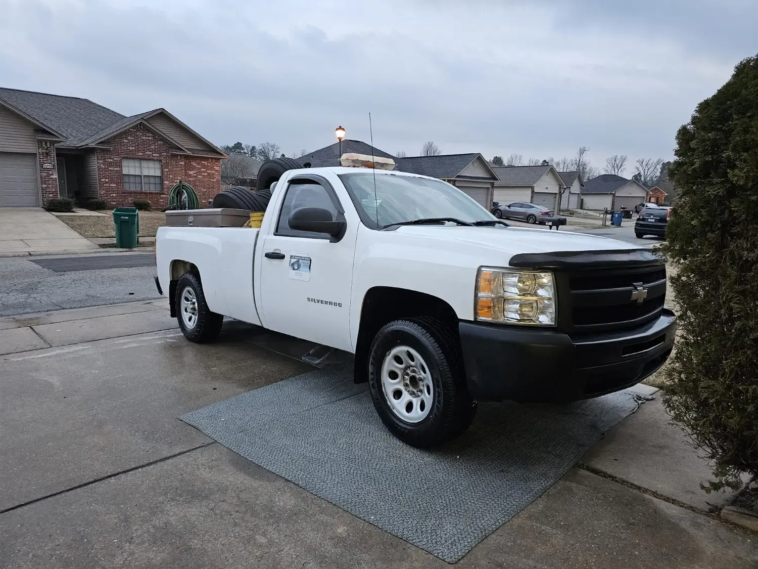 Chevrolet Silverado mobile tire shop truck loaded with tires and equipment in Alexander, AR neighborhood