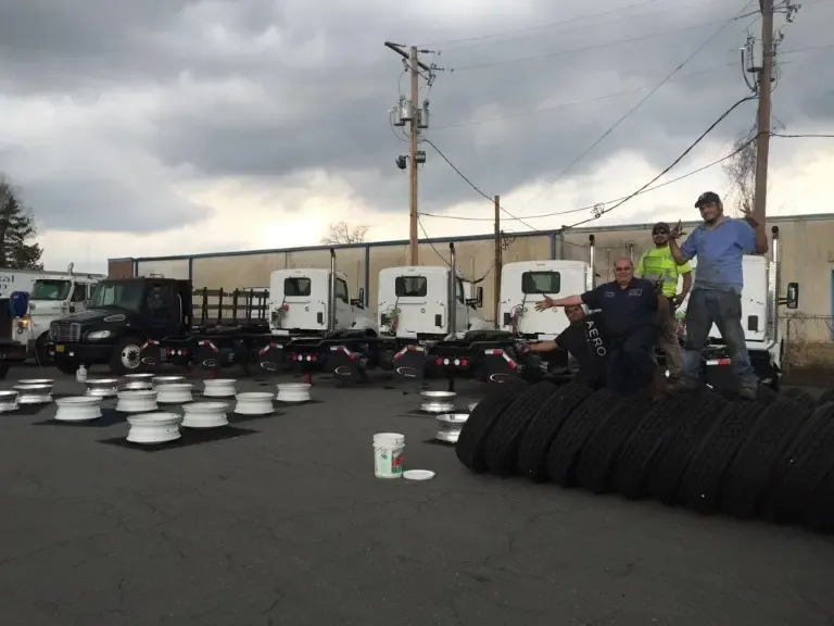 J&L Gonzalez team posing with fleet of box trucks after completing full tire replacement in Arkansas