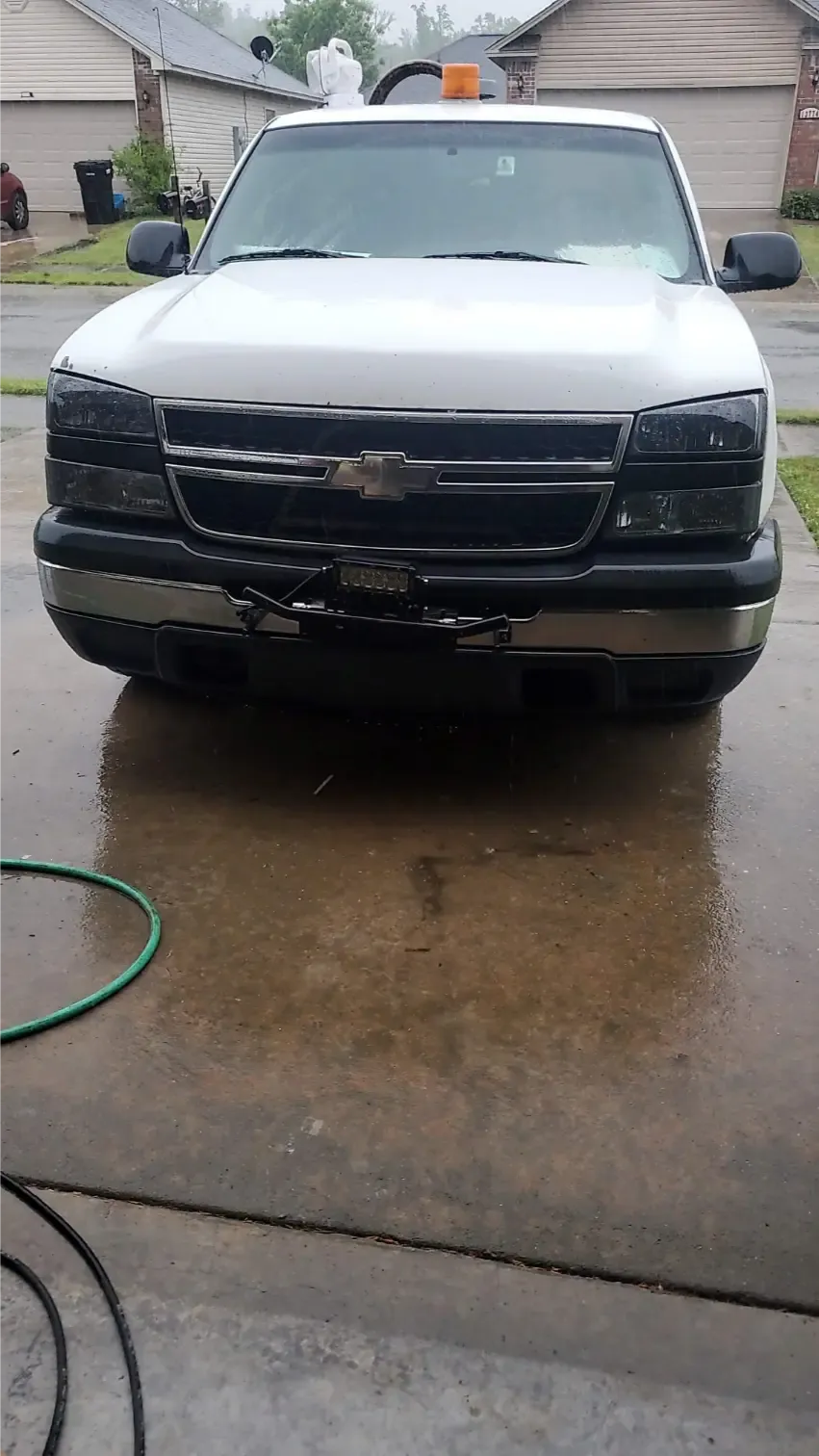 Front view of J&L Gonzalez Chevrolet Silverado mobile tire service truck with LED light bar in Alexander, AR